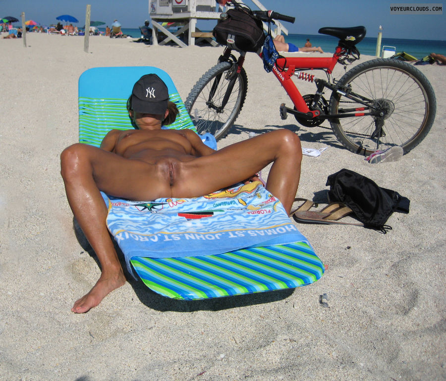 nude beach, shaved, tanned, legs wide open